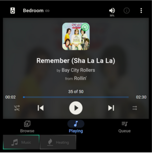 A media player display with a second tab for heating control